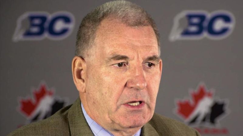 An interview subject in front of a BC Hockey and Hockey Canada backdrop